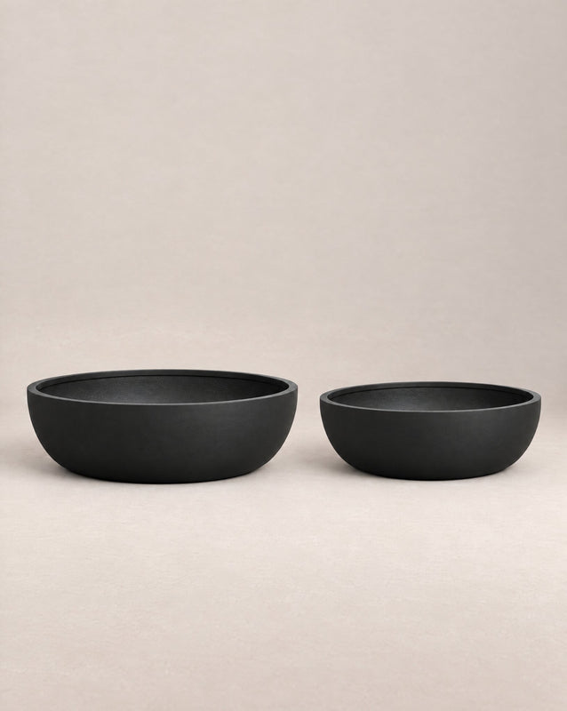Barbota black outdoor planter with a wide, low bowl shape