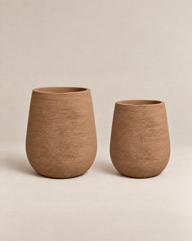 Gemma ribbed desert-finish outdoor planter with a tall, tapered egg shape