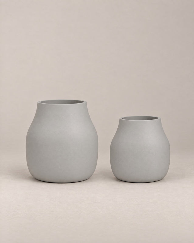 Padina white outdoor planter with a curved, cinched-waist shape and rounded base