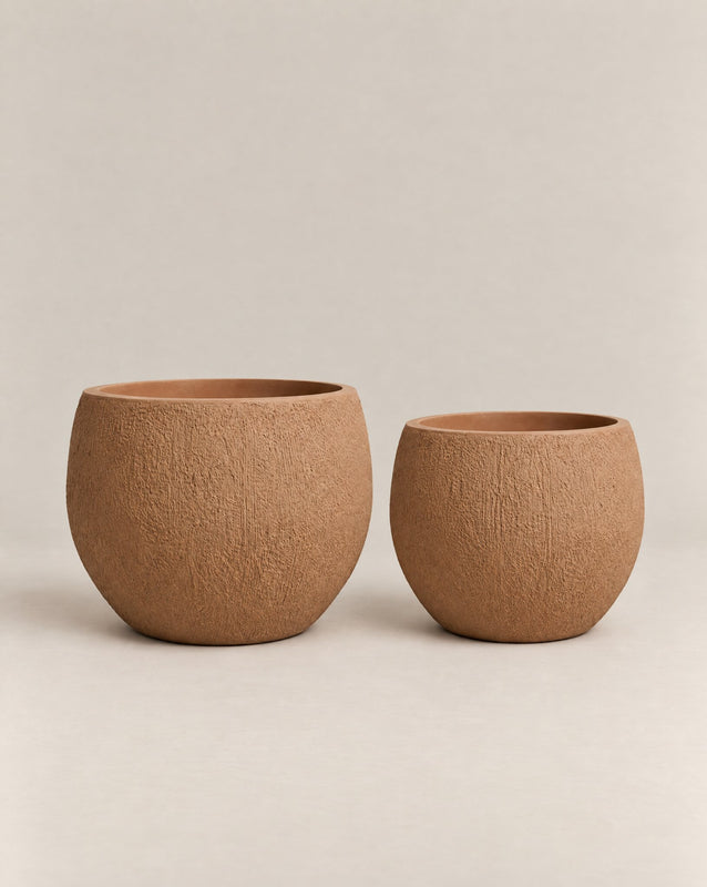 Demi Tassina textured desert-finish outdoor planter with straight cylindrical walls and a rounded base