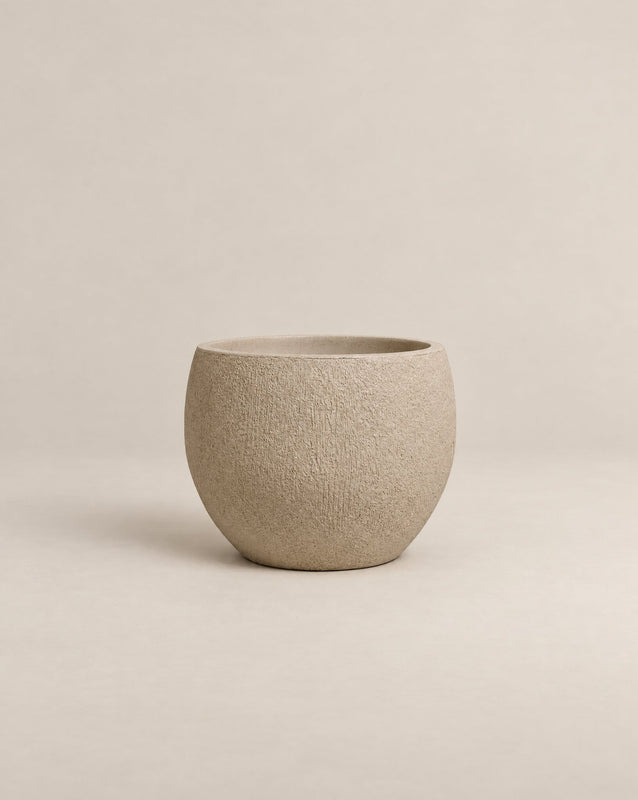 Demi Tassina textured putty-finish outdoor planter with straight cylindrical walls and a rounded base – alternate view
