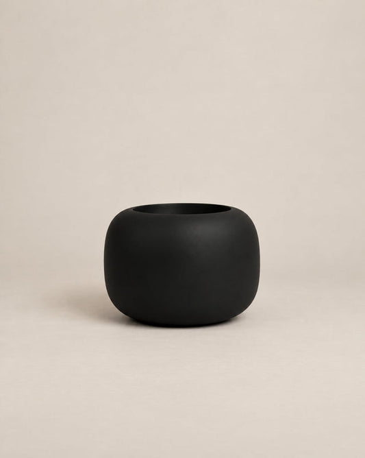 Durum Low black outdoor planter with a compact, rounded shape