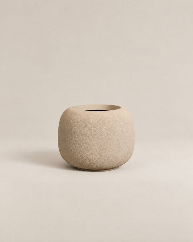 Durum Low putty rough outdoor planter with a compact, rounded shape