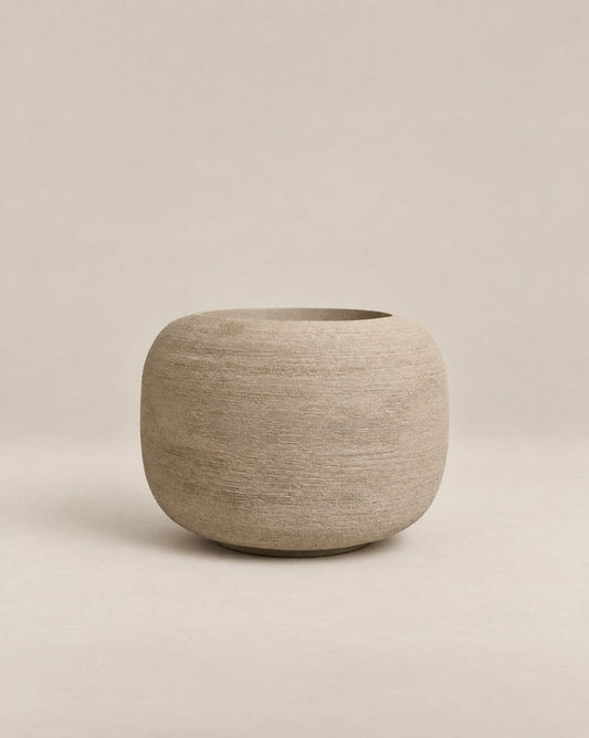 Durum Low putty stone outdoor planter with a compact, rounded shape