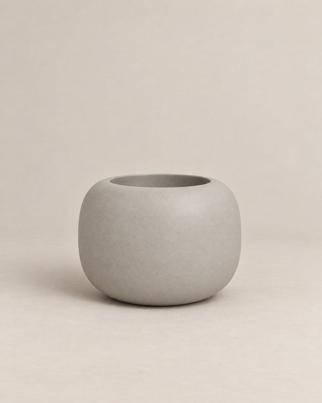 Durum Low white outdoor planter with a compact, rounded shape