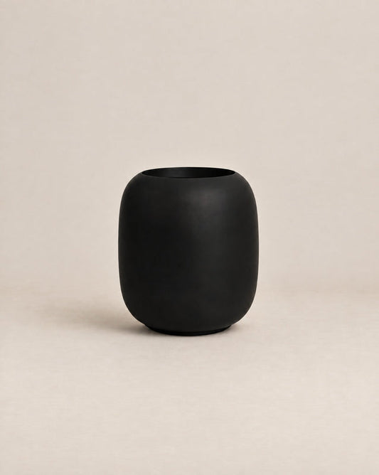 Durum Tall black outdoor planter with a rounded barrel shape and footed base – alternate view