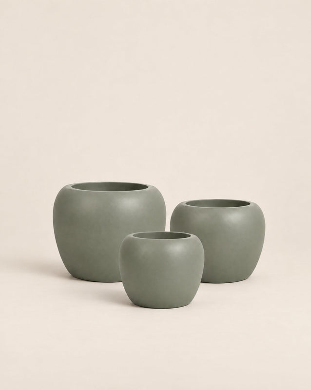 Korby Low green outdoor planter with a low, rounded barrel shape – shown as a cluster
