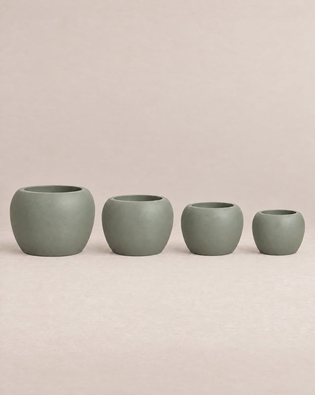 Korby Low green outdoor planter with a low, rounded barrel shape