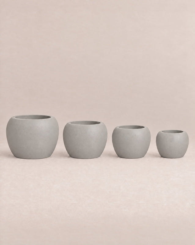 Korby Low white outdoor planter with a low, rounded barrel shape