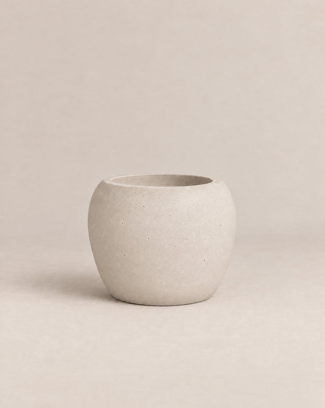 Korby Low grey outdoor planter with a low, rounded barrel shape – alternate view
