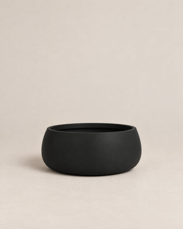 Nenufah black outdoor planter with a wide, shallow bowl shape and angled sides