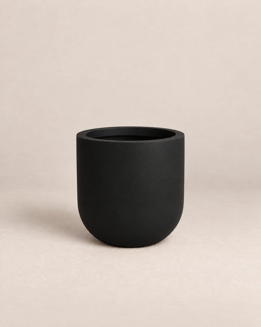 Tassina black outdoor planter with cylindrical walls and a rounded base – alternate view