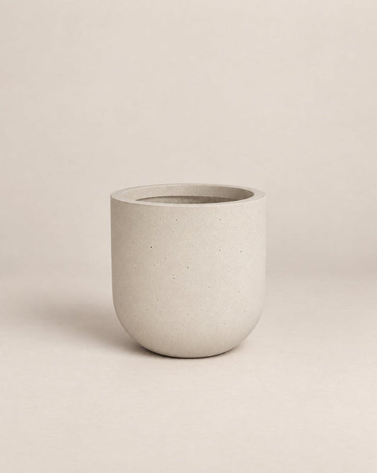 Tassina grey outdoor planter with cylindrical walls and a rounded base – alternate view