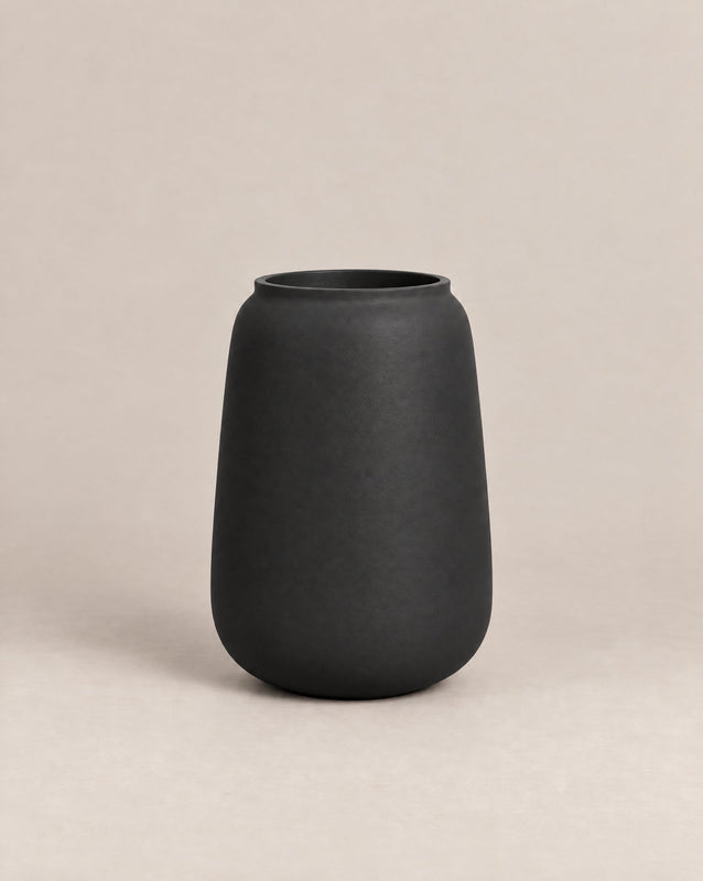 Vaso textured black-finish outdoor planter with a tall, tapered shape