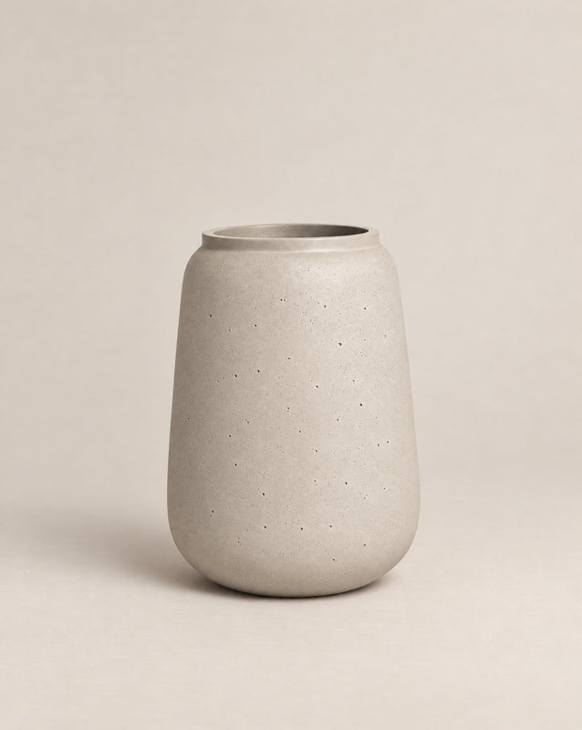 Vaso textured grey-finish outdoor planter with a tall, tapered shape